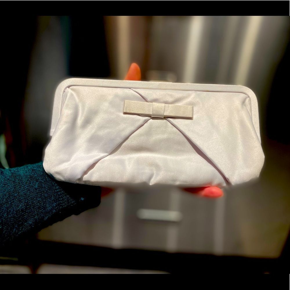 Adorable vintage white satin-y clutch, with pockets!